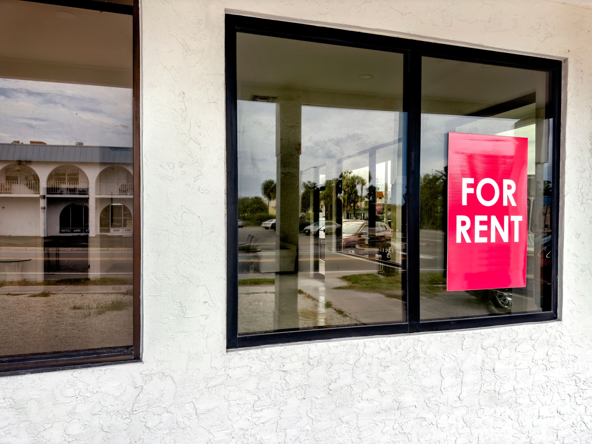 For rent sign attached on exterior glass window